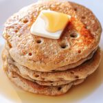 sourdough gingerbread pancakes topped with butter and maple syrup