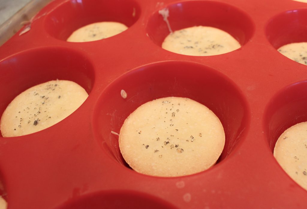 baked mini pizza crusts topped with charcoal sea salt