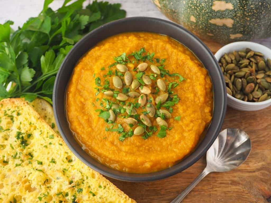 pumpkin and sweet potato souop topped with pumpkin seeds