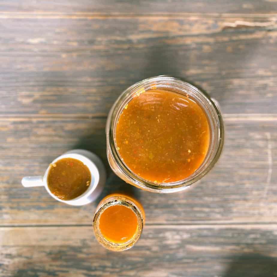 homemade hot sauce in different jars and vessels