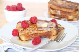 sourdough french toast topped with raspberries