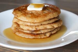 sourdough gingerbread pancakes topped with butter and maple syrup