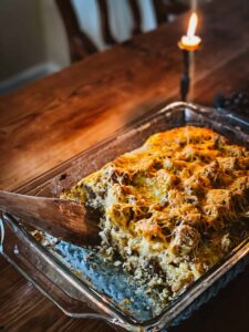 savory breakfast bake on table with candle