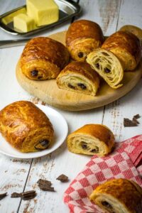 chocolate croissants display with butter on plates